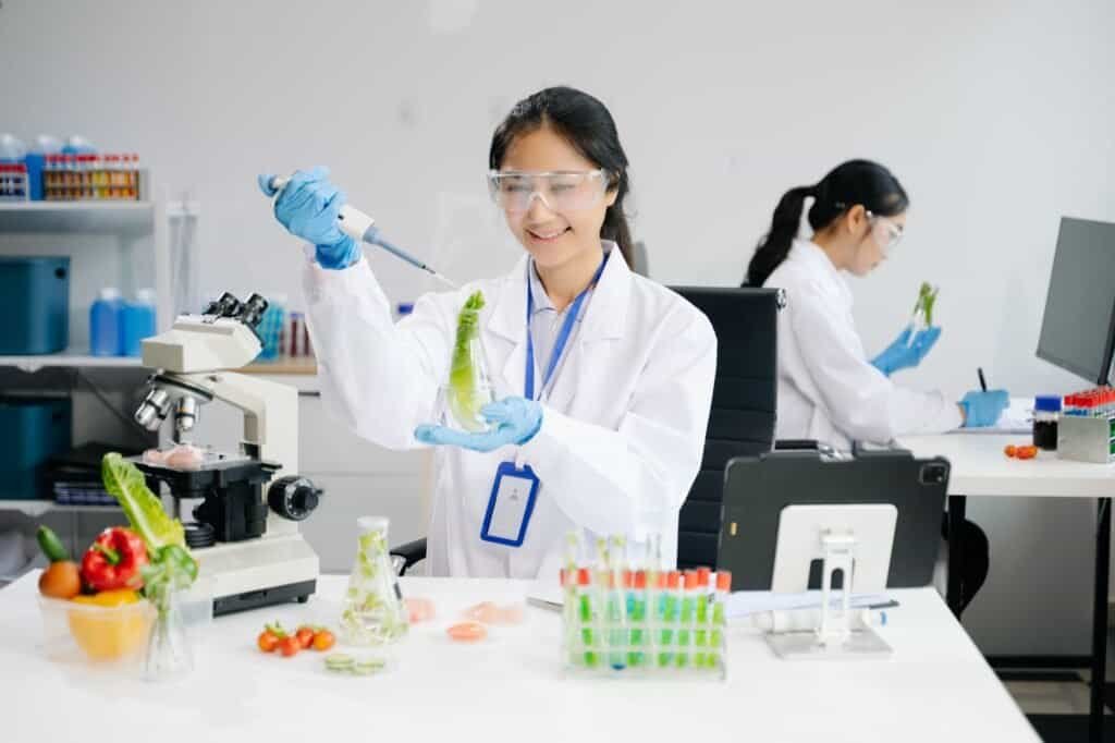 Food science as lab scientists test and analyze vegetables for safety