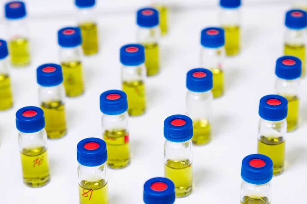Pattern from HPLC glass vials with yellow fluid. Pharmaceuticals and chemical analysis