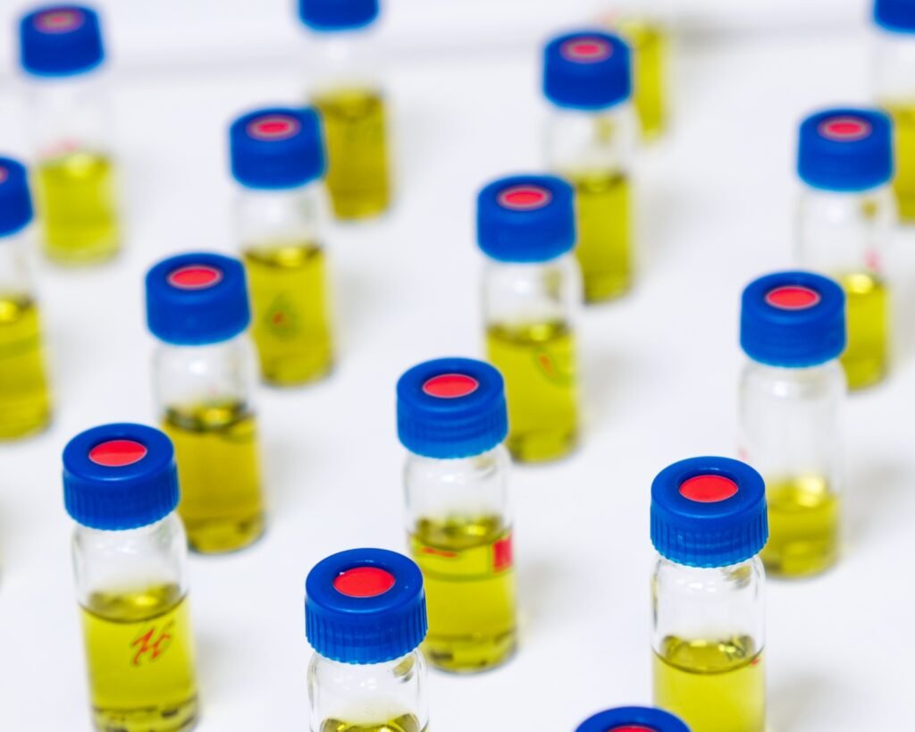 Pattern from HPLC glass vials with yellow fluid. Pharmaceuticals and chemical analysis