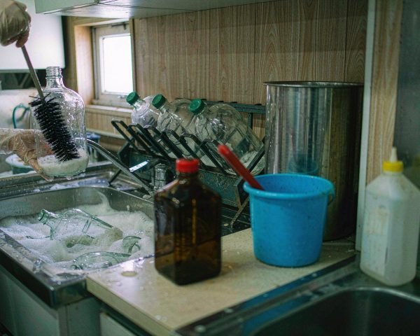 how to clean and decontaminate reagent bottles safely